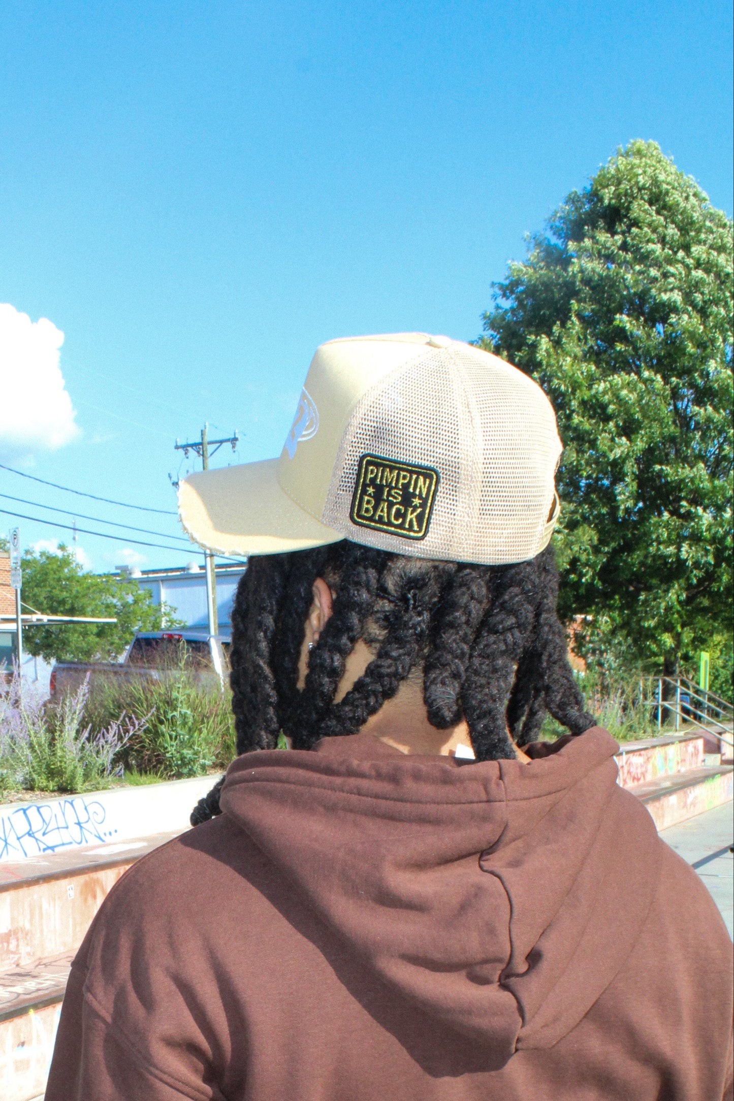 “Pimpin’ Is Back” Tan Trucker Hat